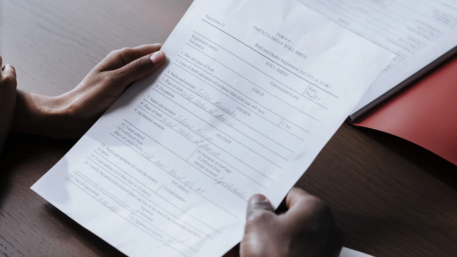 Medical form and records being reviewed at a desk