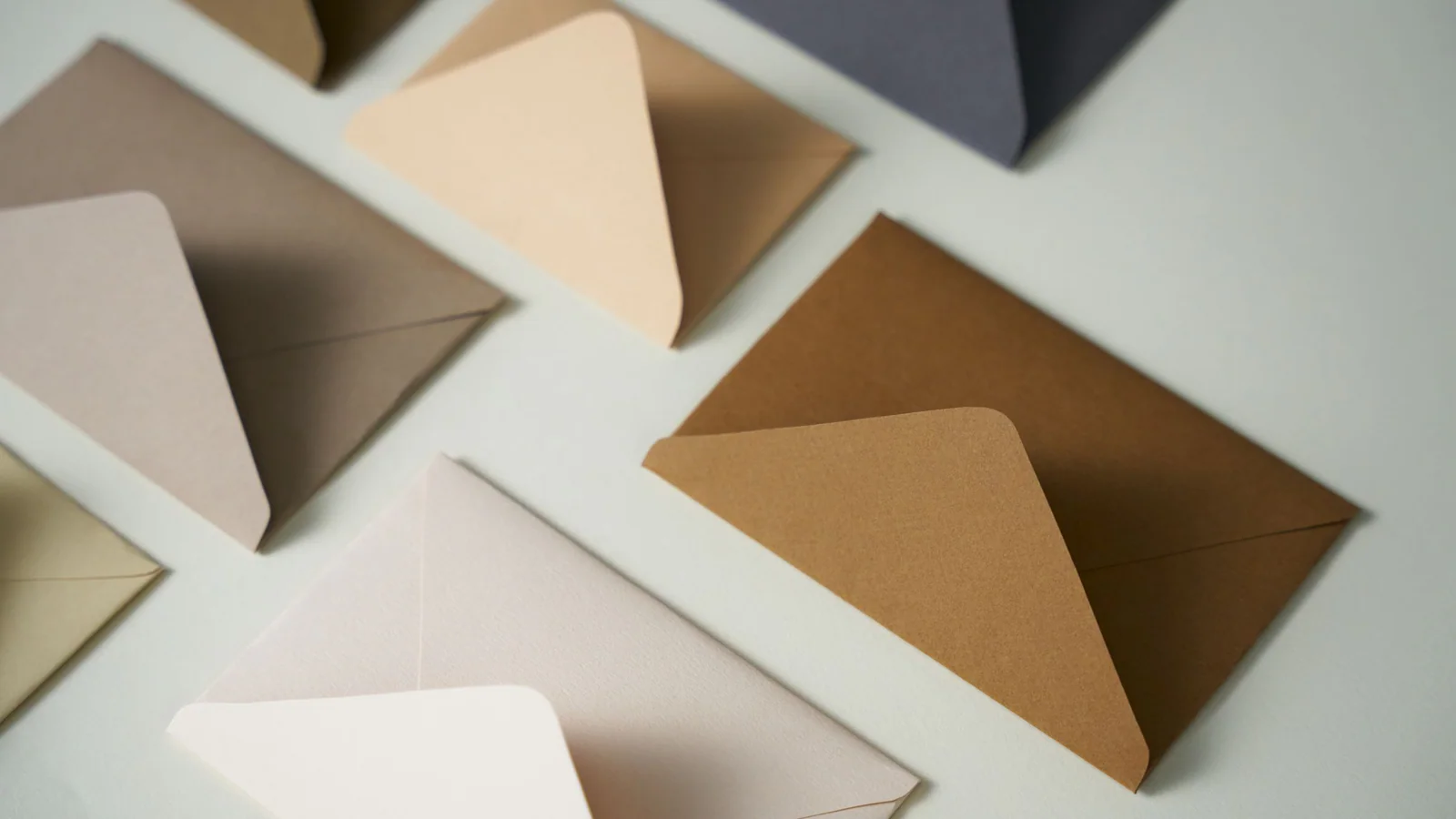 Blank coloured envelopes arranged for separate document handoffs