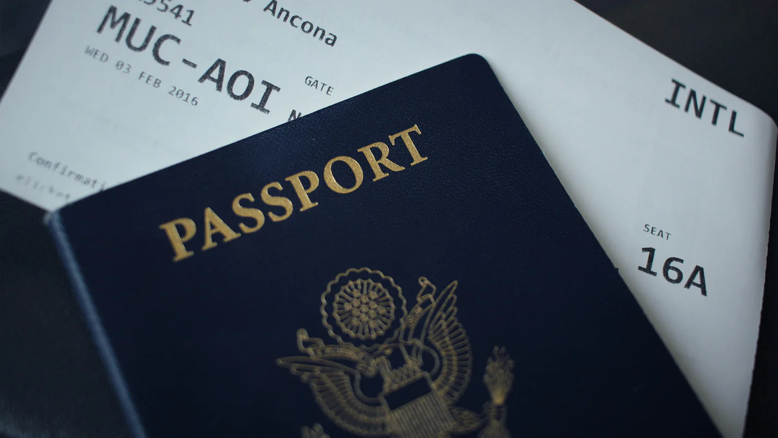 Employer-side folder and passport prepared for a foreign-worker visa application