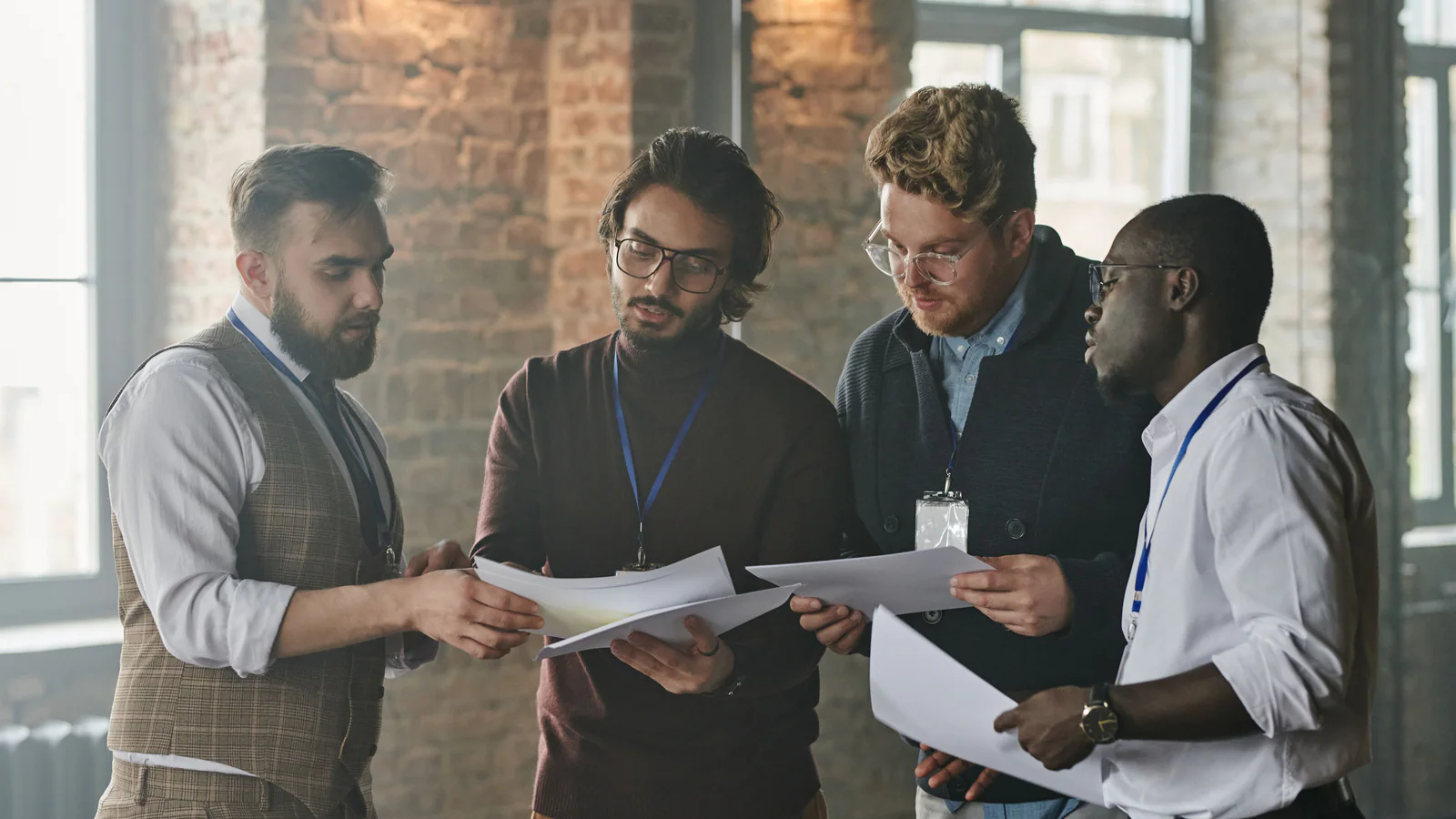 Diverse professionals reviewing documents around a meeting table