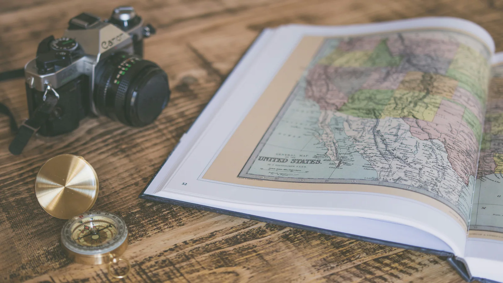 Compass on an open map used as a metaphor for choosing the next parenting-plan step