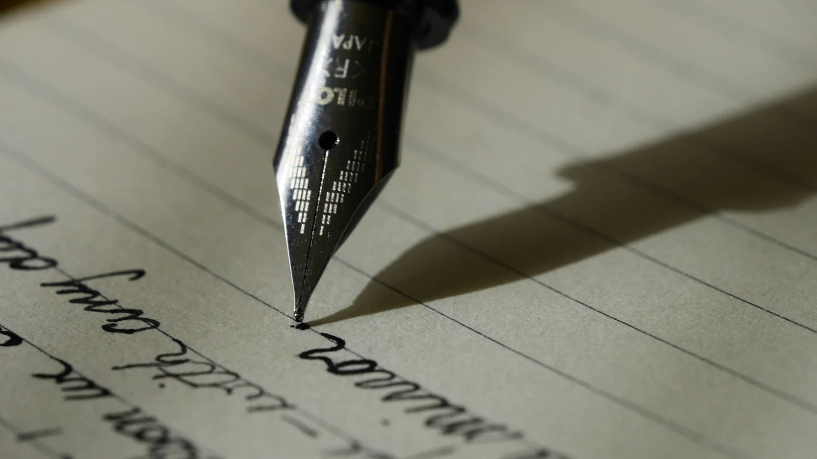 Fountain pen on paper used as a metaphor for reviewing a parenting plan before signing