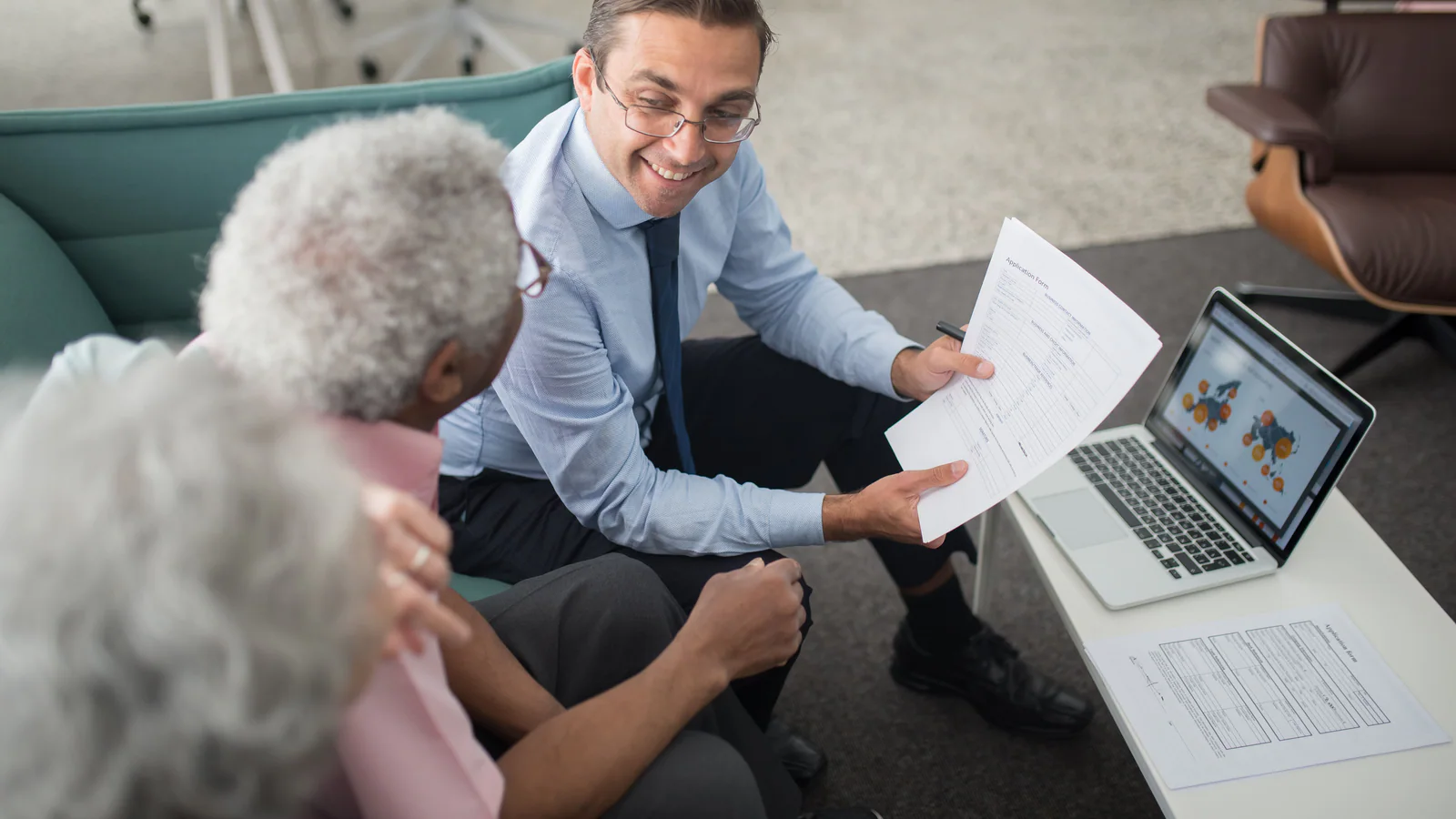 Older adults reviewing planning documents with an adviser