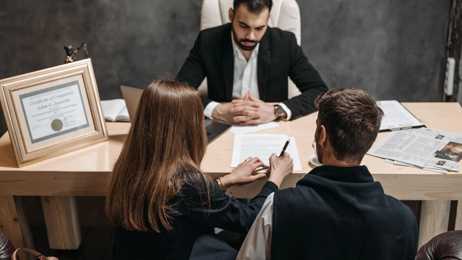 People reviewing documents during a professional consultation