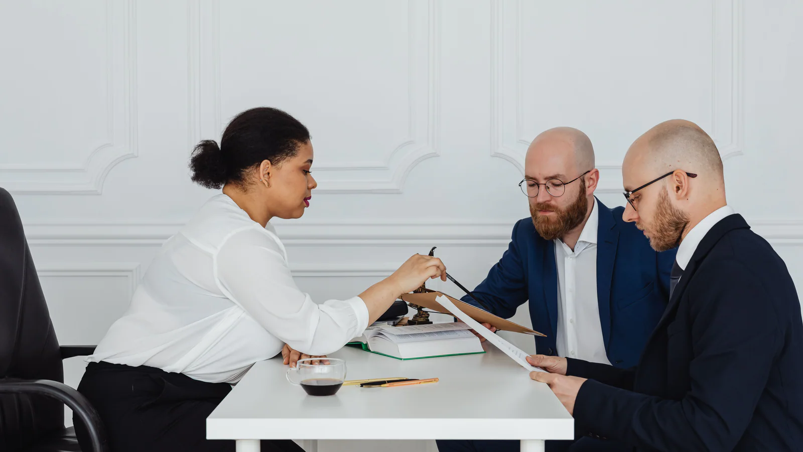 Business team reviewing documents together at an office table