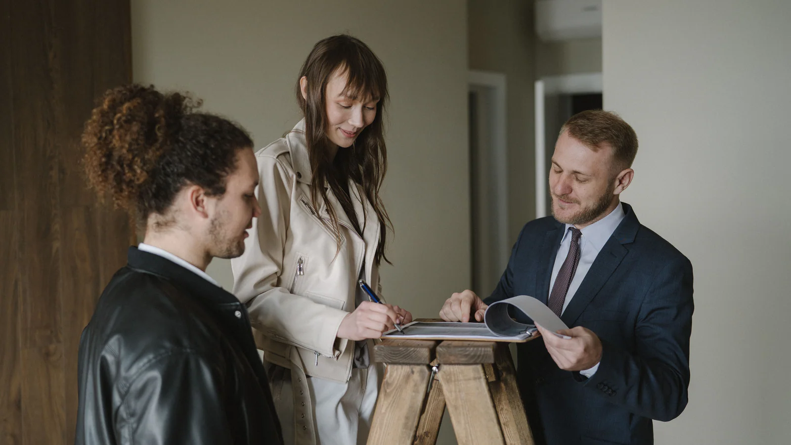 People reviewing property documents in a new home