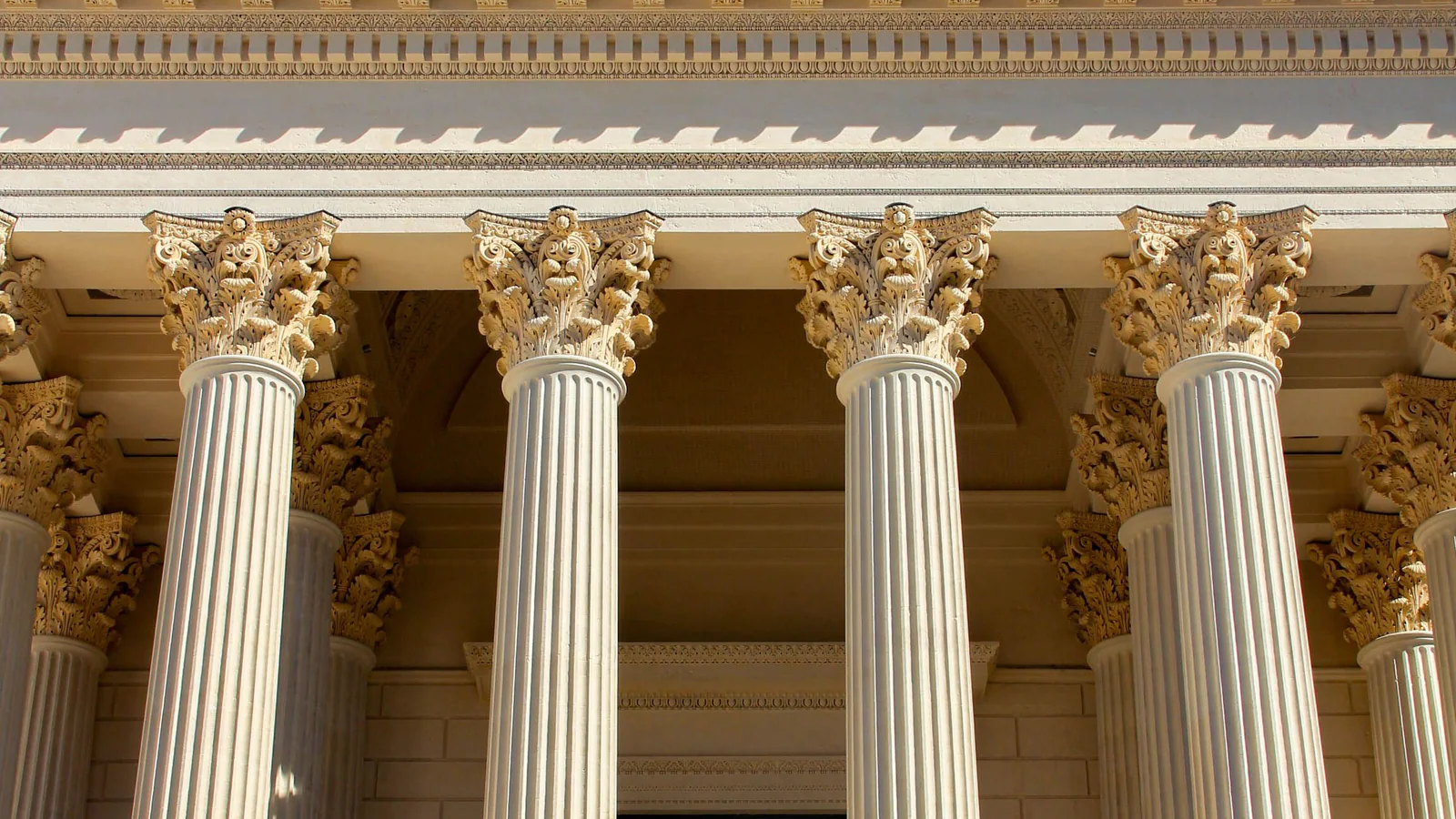 Neoclassical public building with columns under a blue sky
