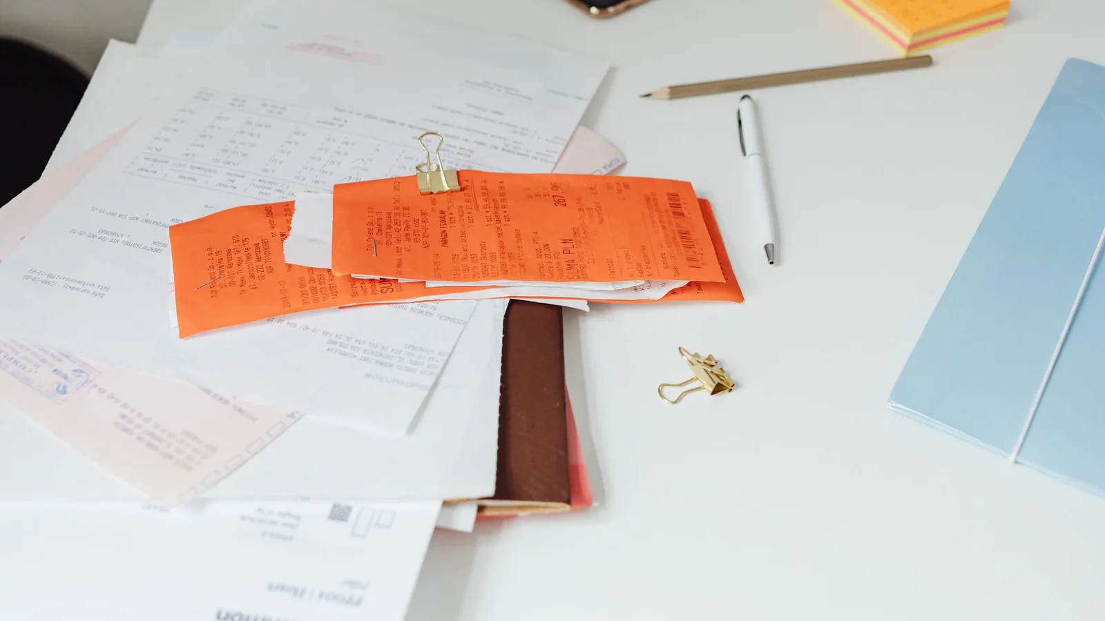 Receipts and documents arranged on a desk