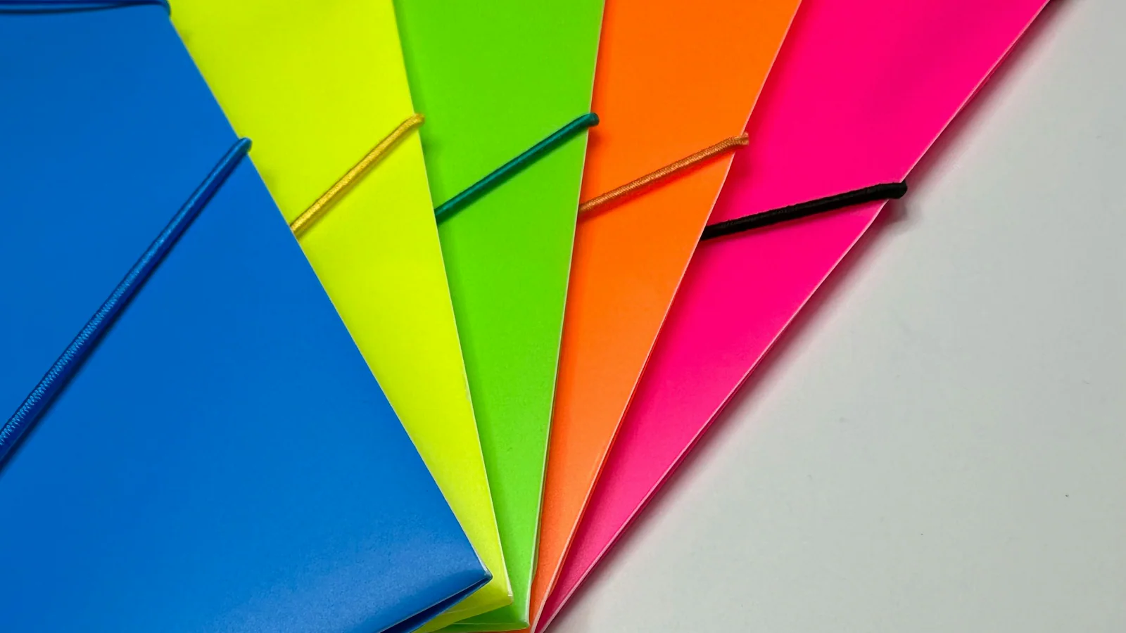 Colour-coded document folders arranged for filing