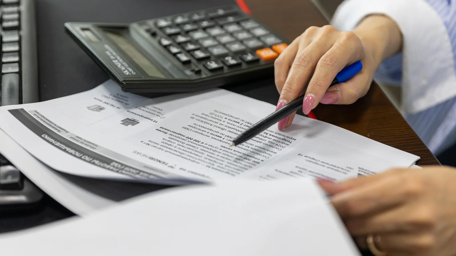 Close-up of financial documents and a calculator
