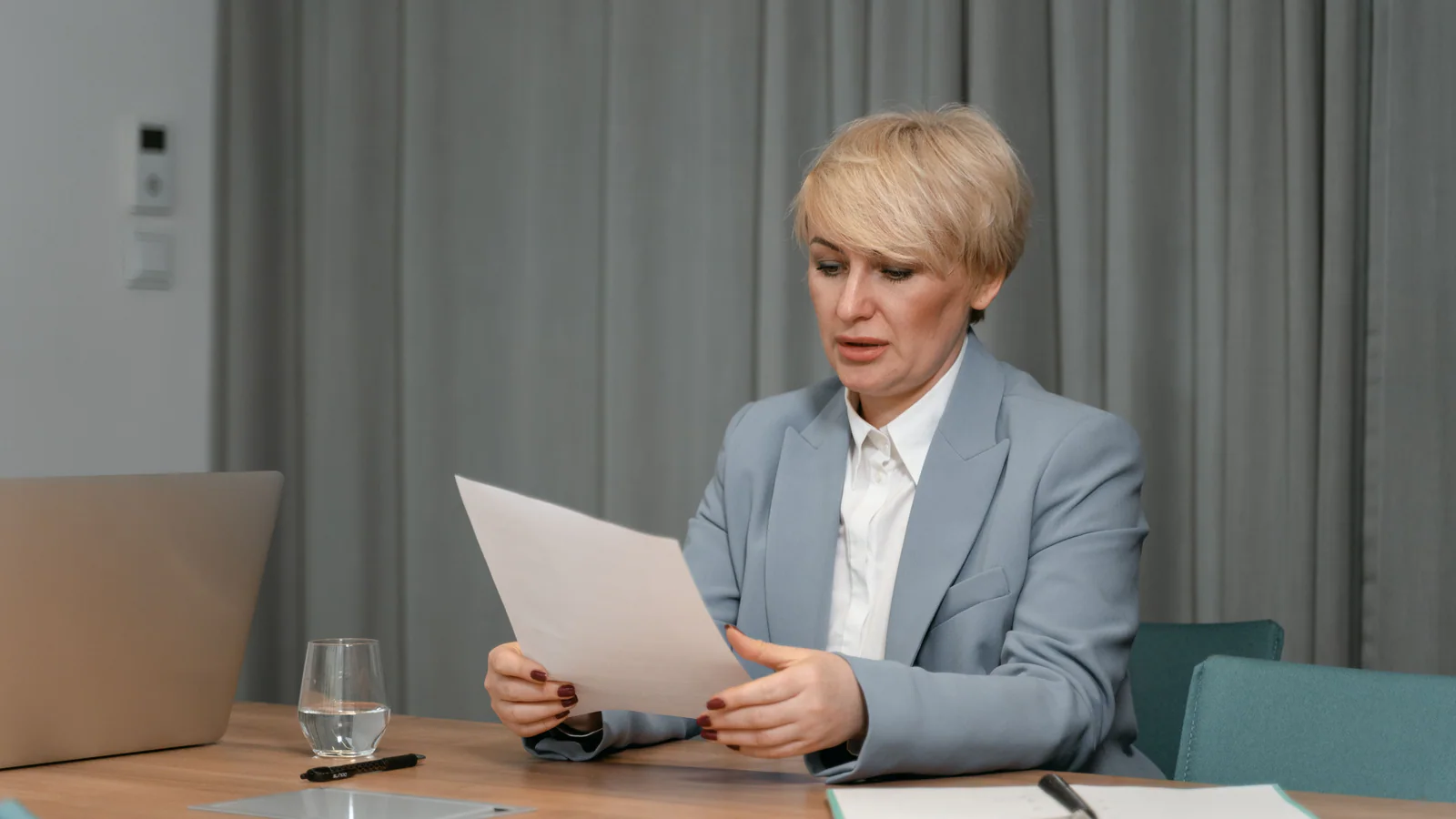 Person reviewing a document at a desk
