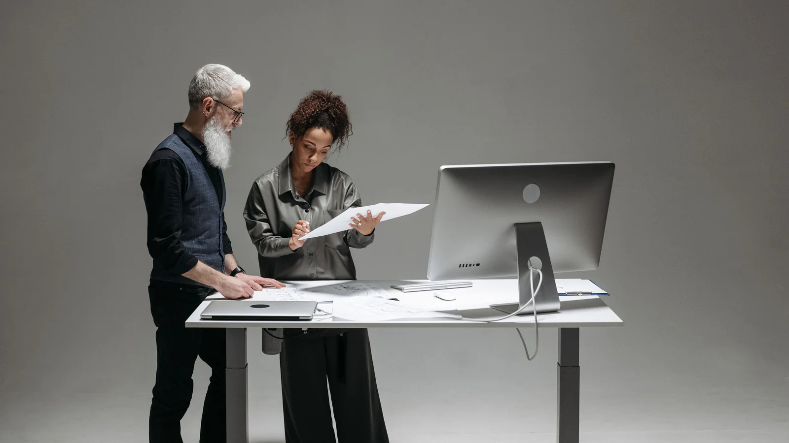 Two people reviewing a document at a desk