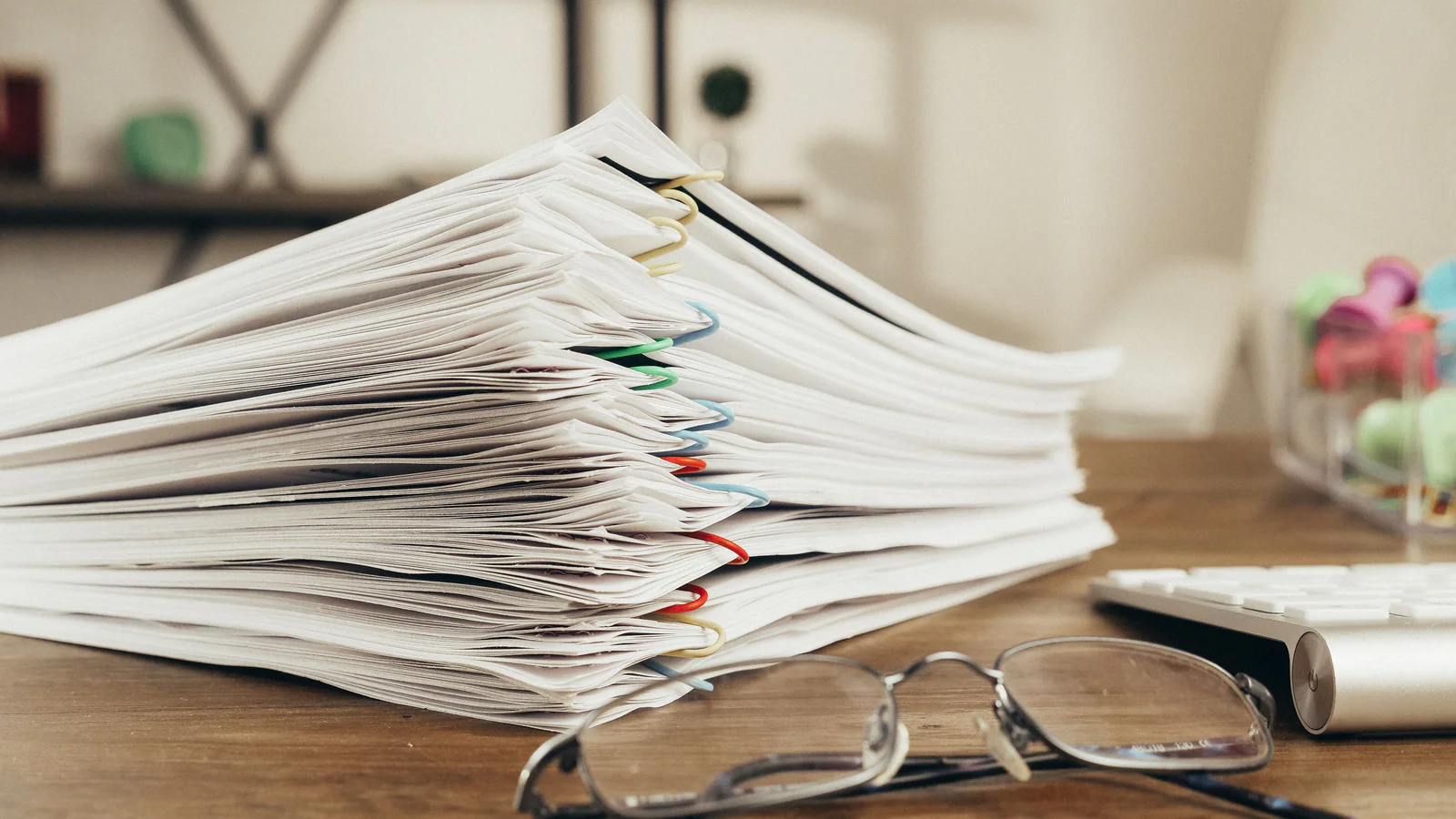 Paper-clipped documents arranged on a desk