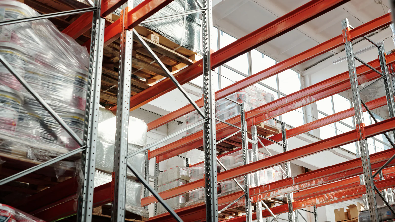 Wrapped pallets stored on warehouse racking