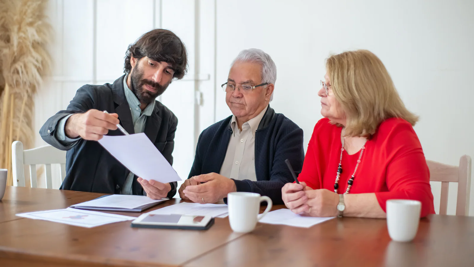 Older couple reviewing planning documents with an adviser