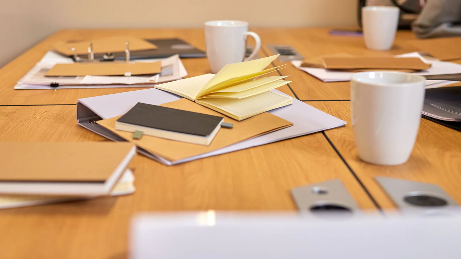 Notebooks and document folders arranged on a consultation table